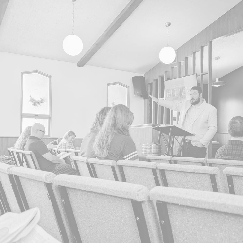 Pastor Andrew preaching on a Sunday morning